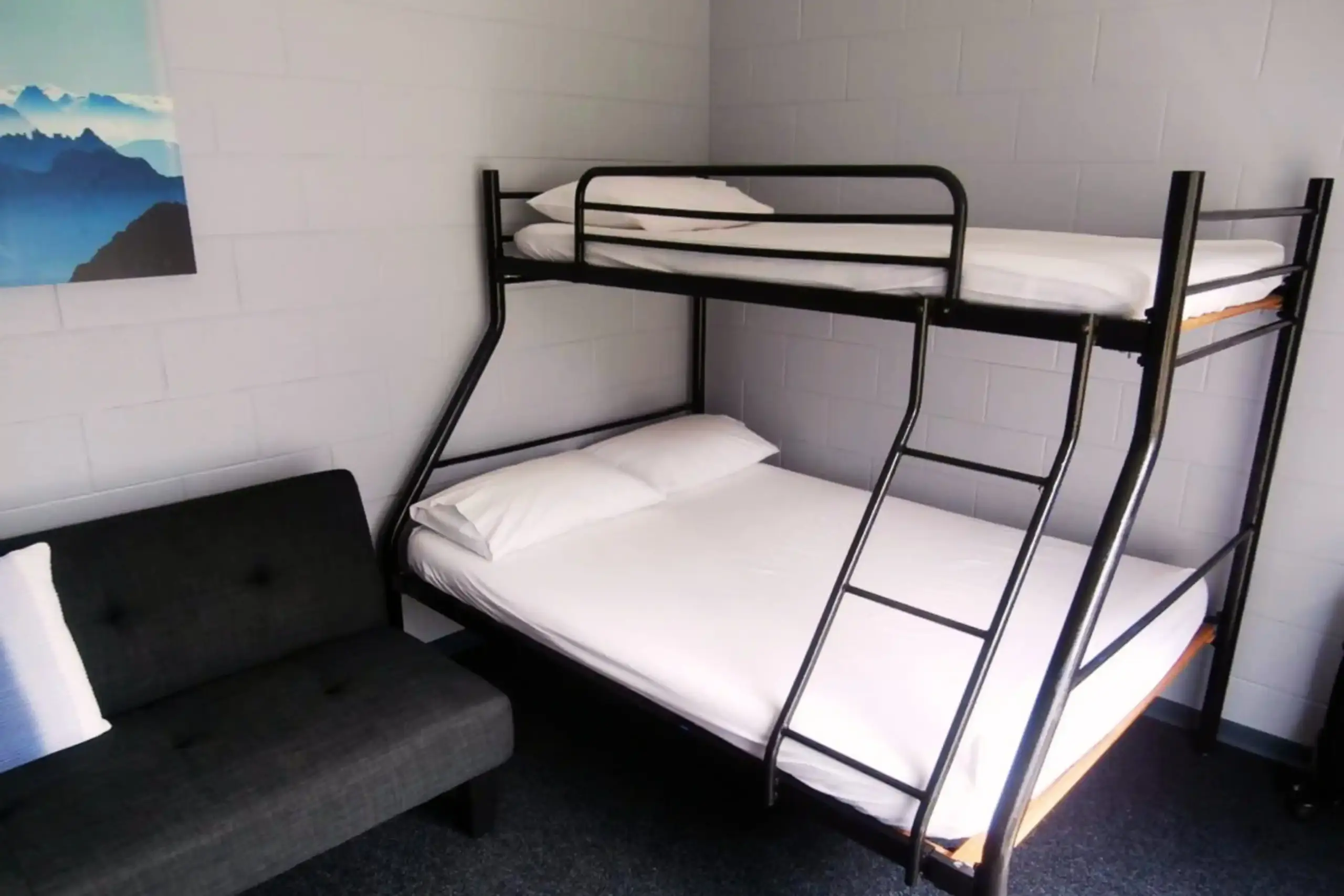 Great Lake Holiday Park Campground Cabin Room Only Inside Simple standard cabin with heating, cooling and TV at Great Lake Holiday Park Taupo.